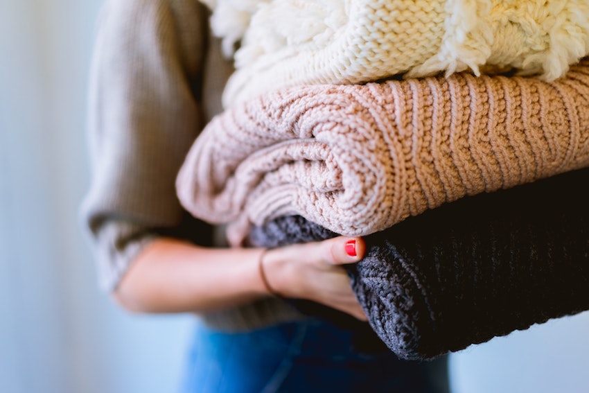 folding blankets and putting them away